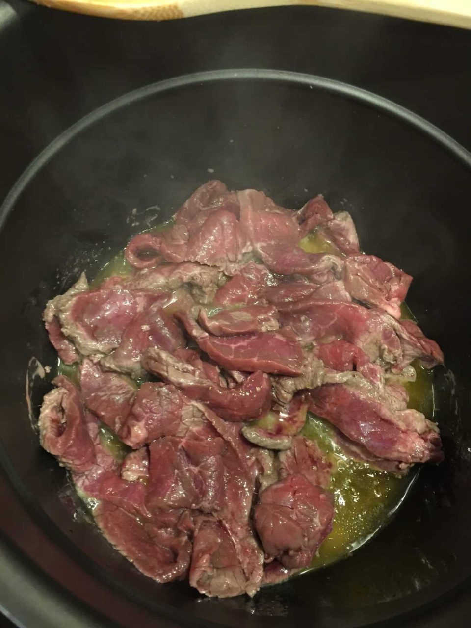Beef slices browning in the Instant pot for Instant Pot Beef with Broccoli