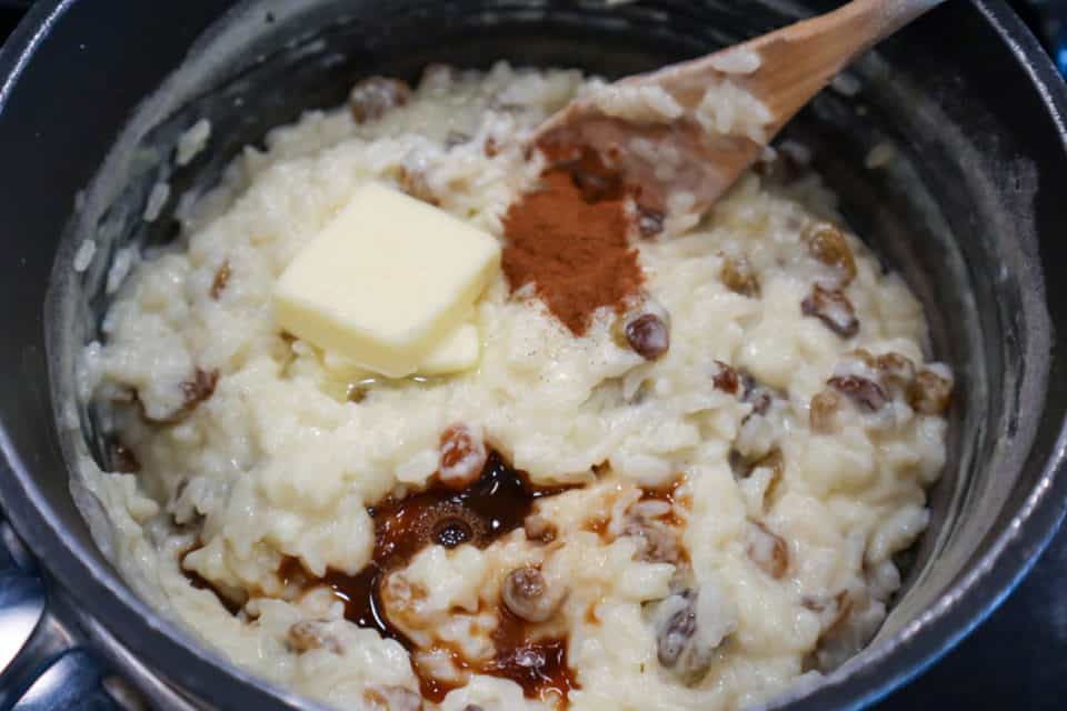 Mixing butter, cinnamon and vanilla into rice mixture for Classic Rice Pudding