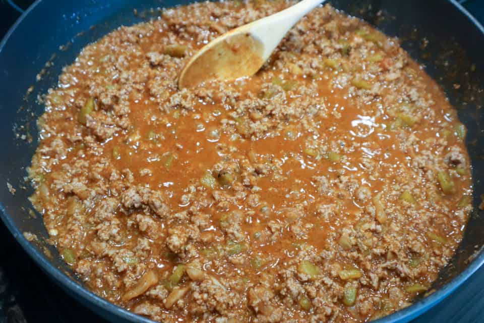 Combined meat mixture in a skillet for Oven Baked Taco Casserole.