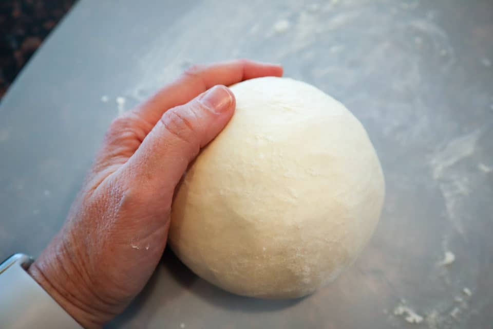 Forming the dough into a ball prior to 2nd rise.