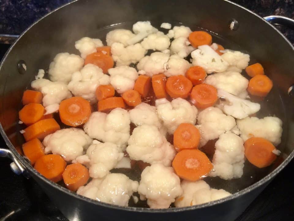 Picture of carrots and cauliflower in a pot of hot water for Hot Italian Giardiniera.