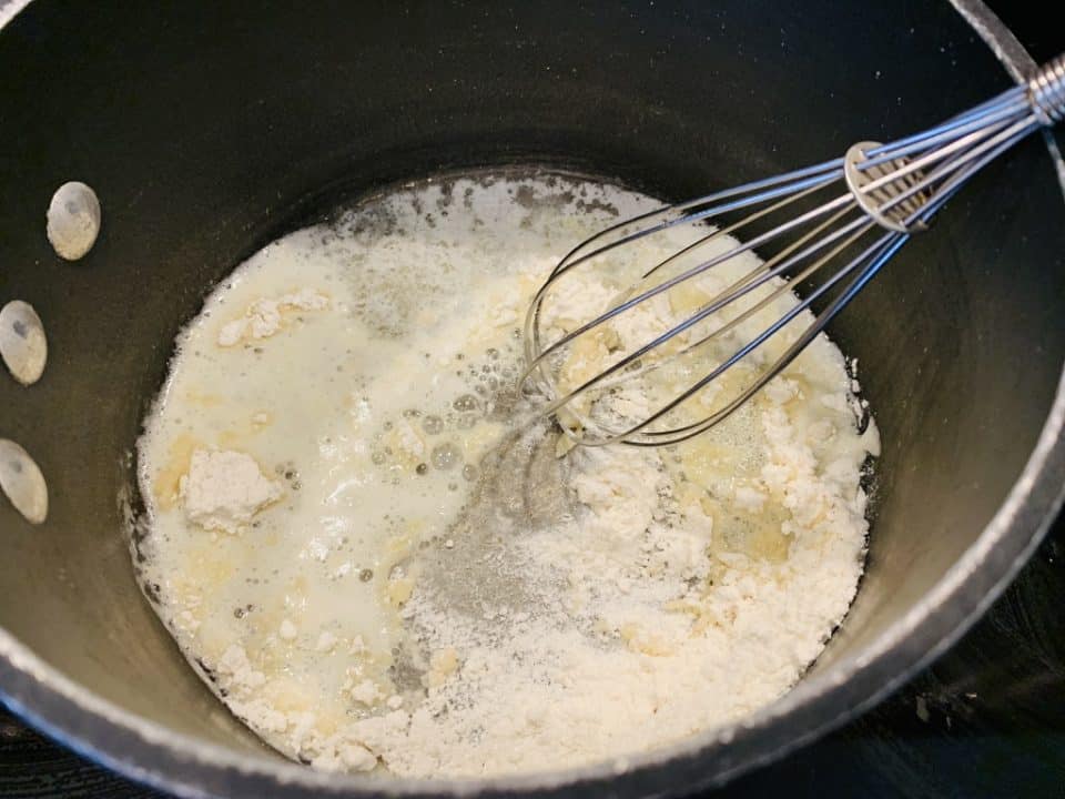 Picture of butter and flour in a saucepan to make the cheese sauce for Pulled Pork Mexican Mac & Cheese.