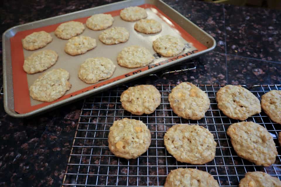 Butterscotch Ranger Cookies post baking on a pan & wire rack. 