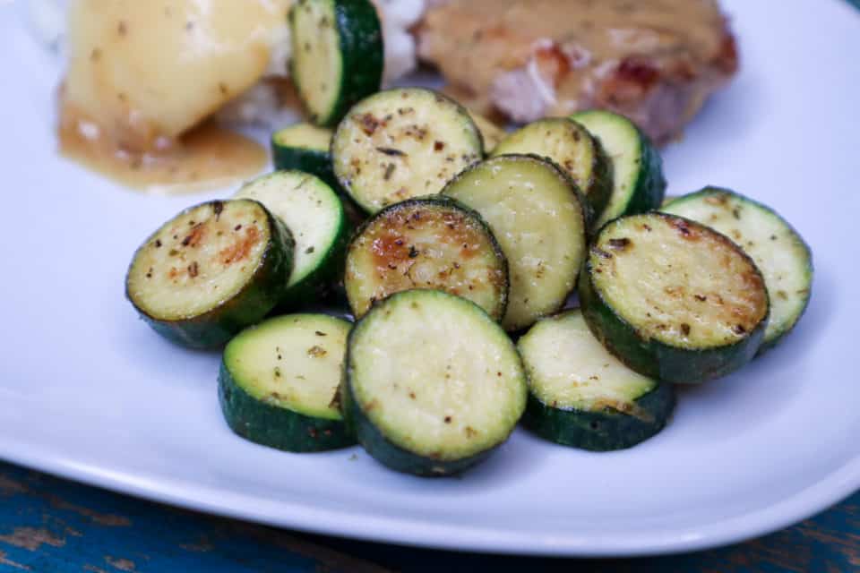 Picture of finished Simple Sauteed Zucchini with Lemon on a plate. 
