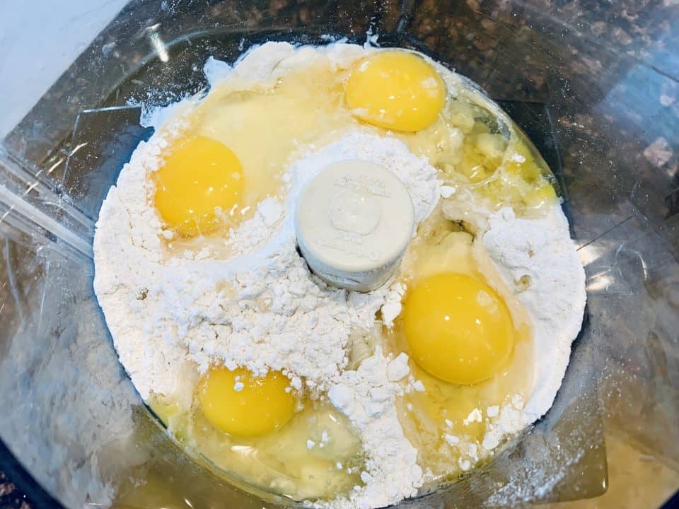 Eggs and flour in a food processor for Fresh Homemade Pasta.