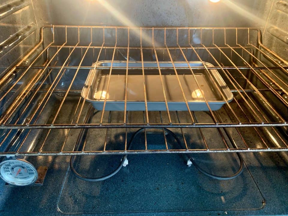 Picture of oven with pan of water on lower rack