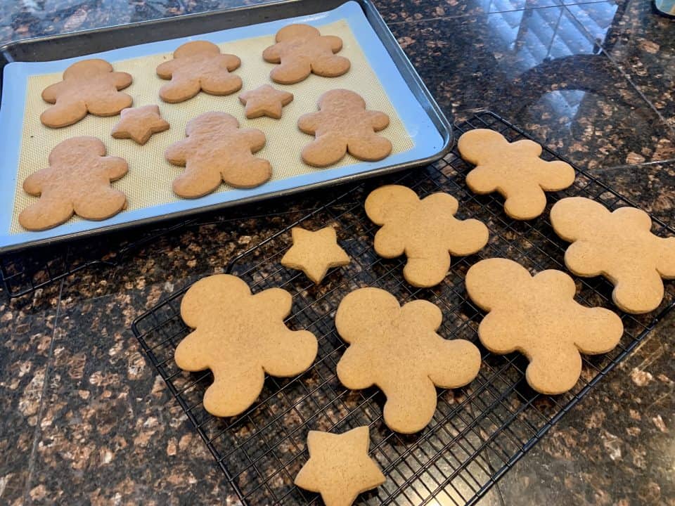 Baked Small Batch Gingerbread Friends on silicone lined baking sheets.