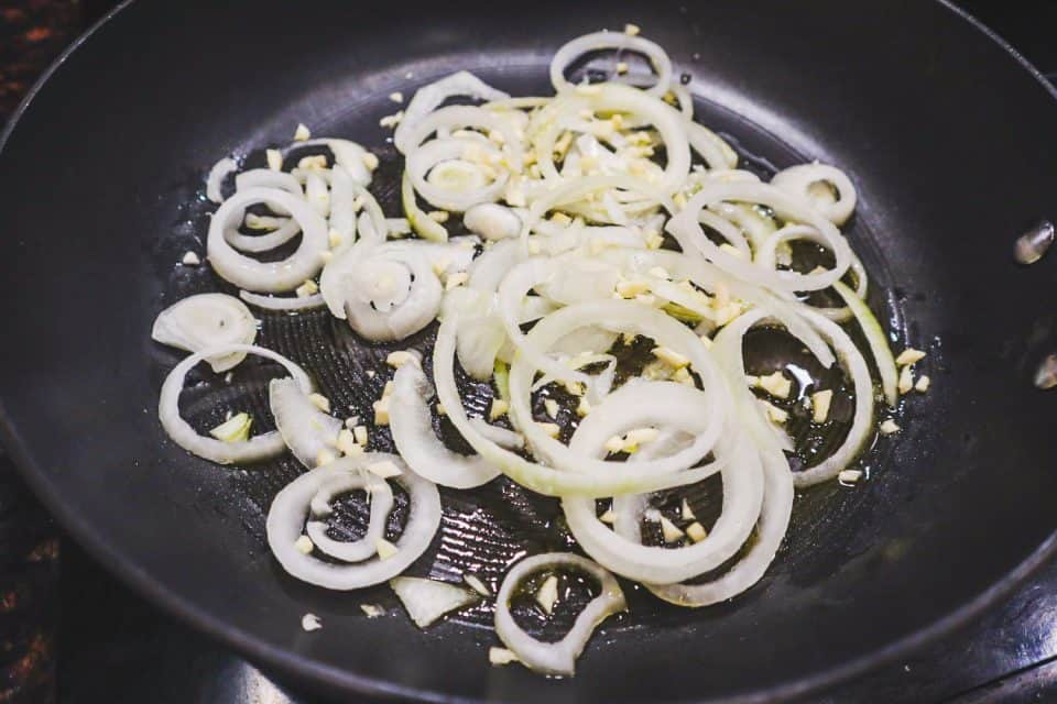 Picture of onions and garlic in a skillet