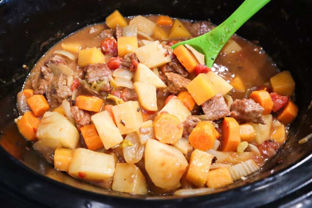 Finished Hearty Slow Cooker Beef Stew in a slow cooker, ready to eat.