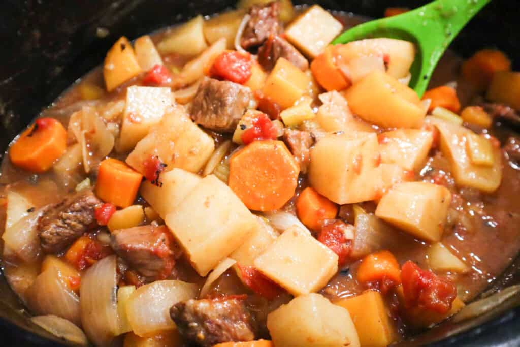 Finished Hearty Slow Cooker Beef Stew in a slow cooker, ready to eat.