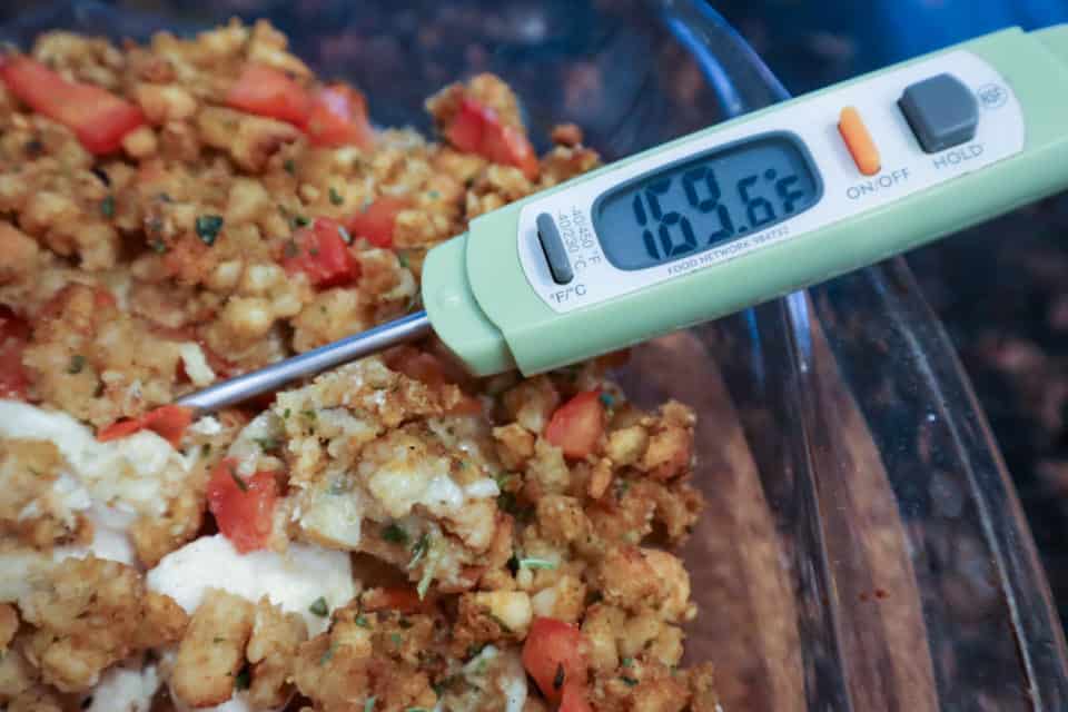Picture of thermometer showing chicken registering 169 degrees F after baking Bruschetta Chicken Bake