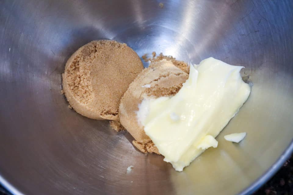 Picture of brown sugar and softened butter in a bowl for Fudgy Salted Cookie Bars.
