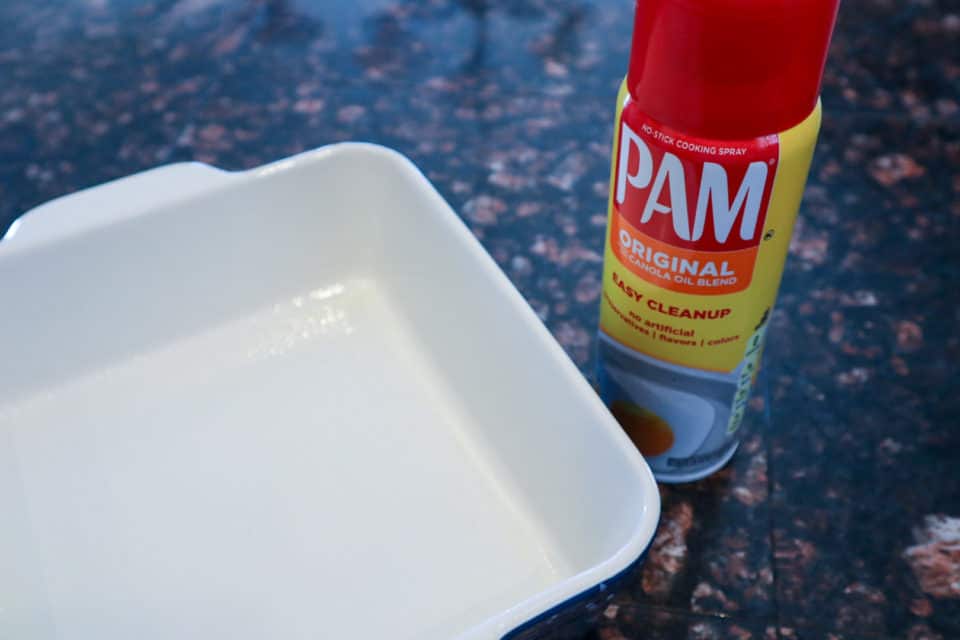 Picture of Pam cooking spray and an empty 8x8 pan for Fudgy Salted Cookie Bars.