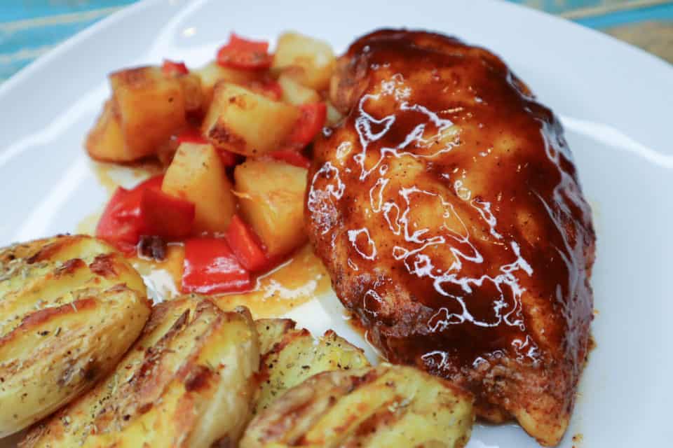 Picture of finished Pineapple BBQ Chicken and pineapple mixture on a plate.