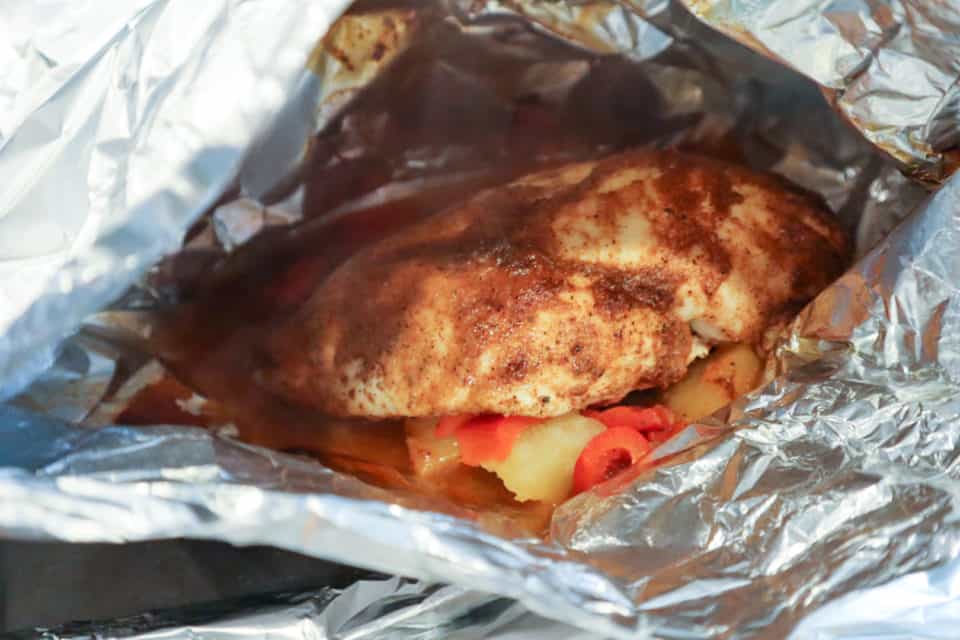 Picture of cooked Pineapple BBQ Chicken inside of Foil Pack.