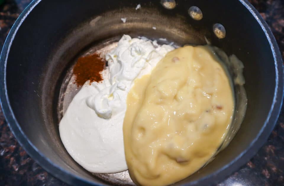 Sour cream base before mixing, in a saucepan.