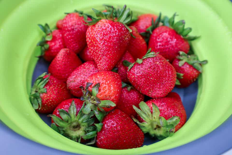 Picture of fresh strawberries in a bowl for Simple Microwave Strawberry Jam.