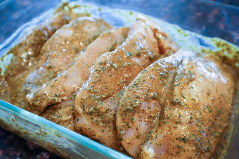 Picture of chicken breasts being marinated in Cilantro Lime Chicken Marinade.
