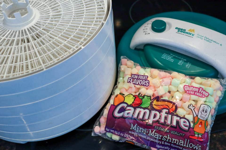 Picture of a dehydrator and an unopened bag of mini marshmallows.
