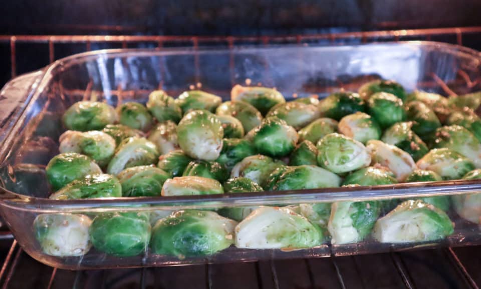 Picture of Brussels sprouts in a baking dish in the oven.