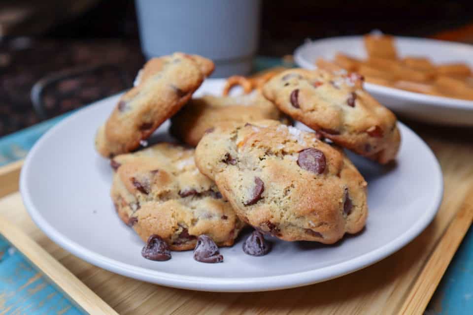 Several baked Caramel Filled Chocolate Chip Pretzel Cookies up close on a plate.