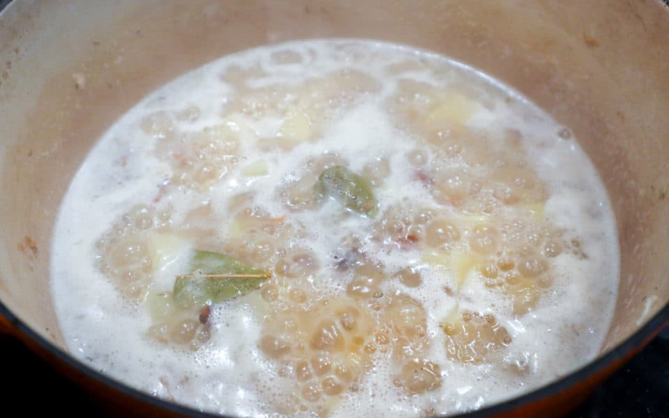 Simmering New England Clam Chowder in a pot.