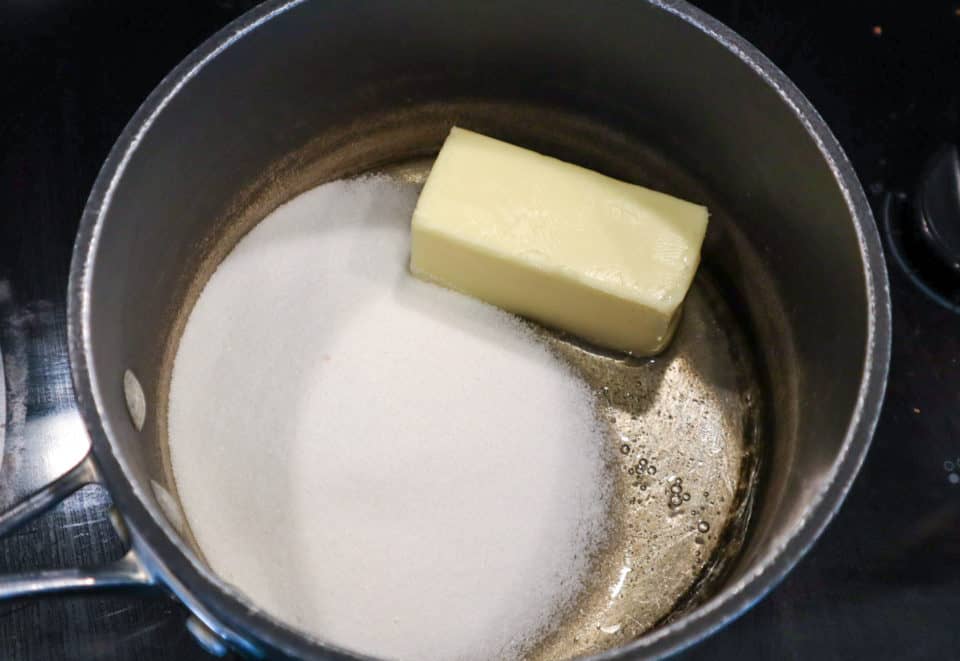 Corn syrup, white sugar and a block of butter in a heavy bottom saucepan.