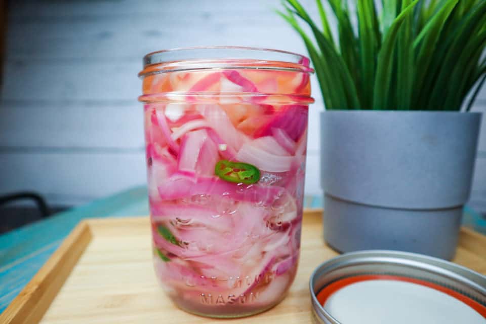 Finished Quick Pickled Red Onions in a jar.