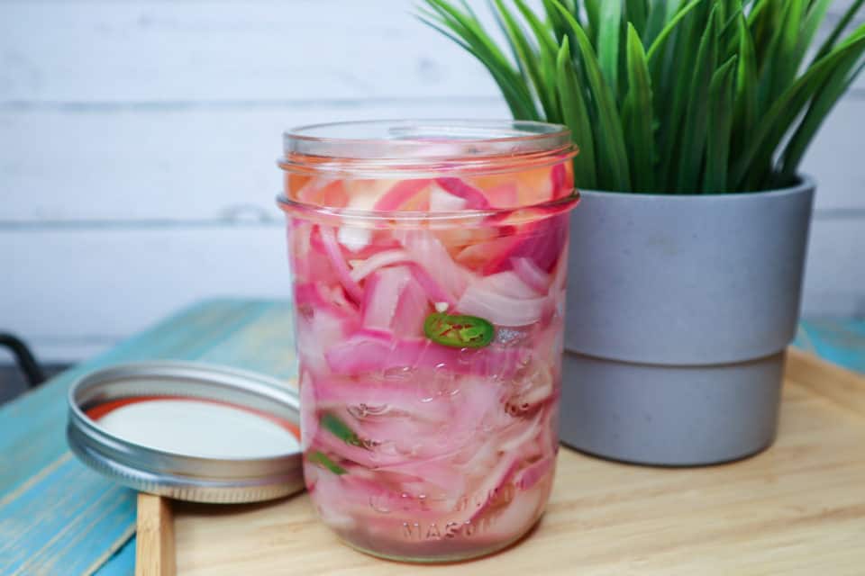 Finished picture of Quick Pickled Red Onions in a jar.