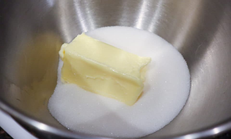Butter and sugar in a bowl prior to creaming.