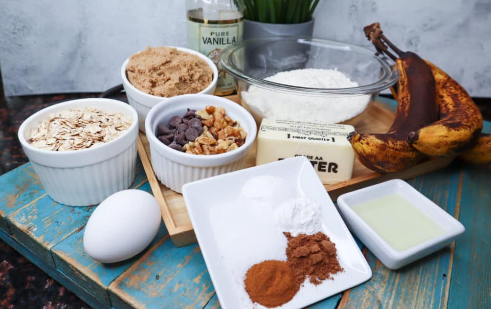 Ingredients for Soft Baked Banana Bread Cookies on a board.