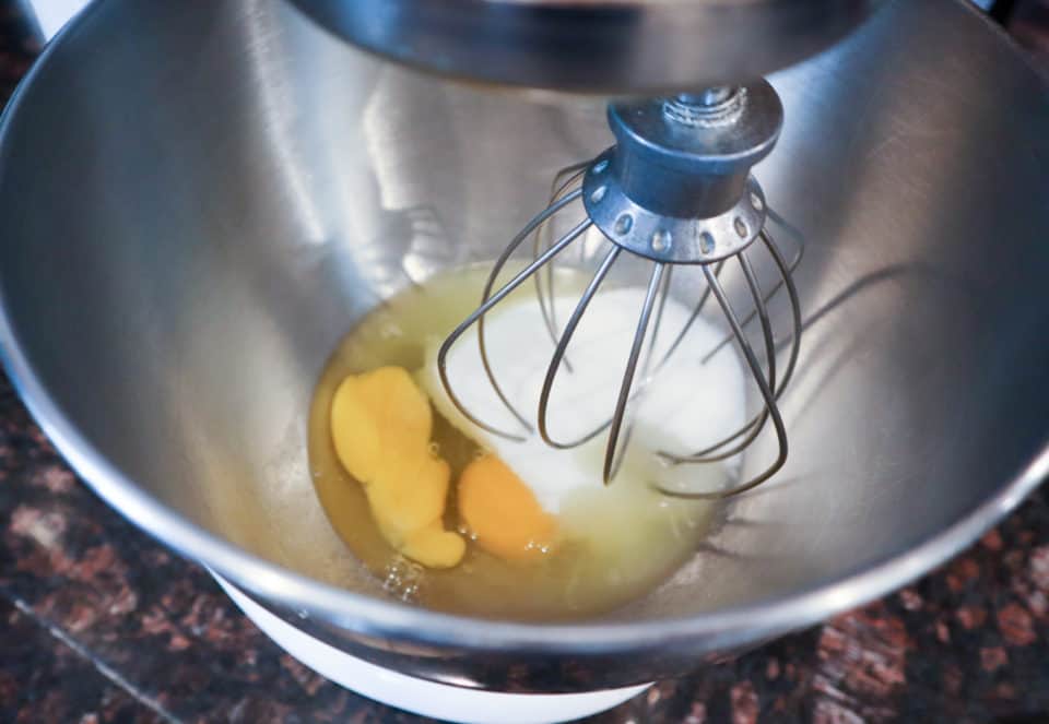 Eggs, milk and pineapple juice in a mixing bowl, prior to mixing.