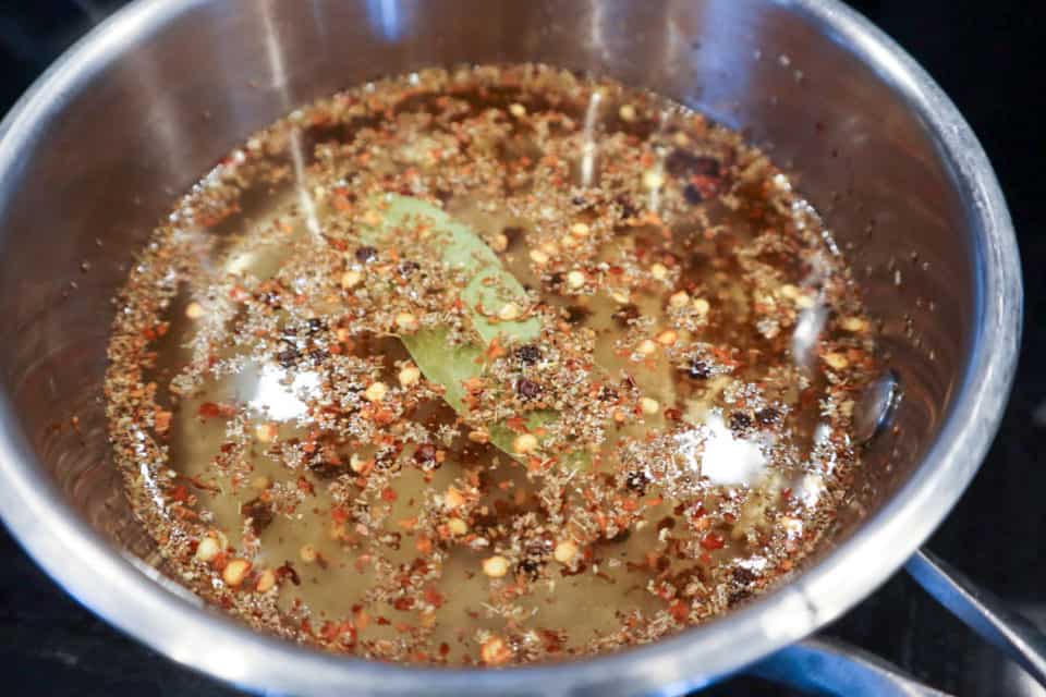 Pickling brine ingredients in a saucepan.