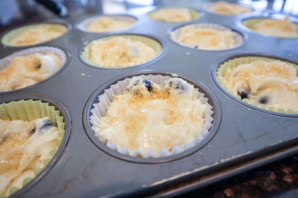 Batter in cupcake liners in muffin tins.