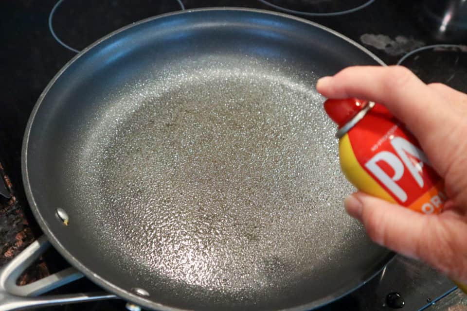 Spraying the skillet with cooking spray