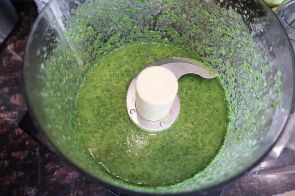 Ingredients for Fresh Lime Chimichurri Sauce in a food processor after processing.