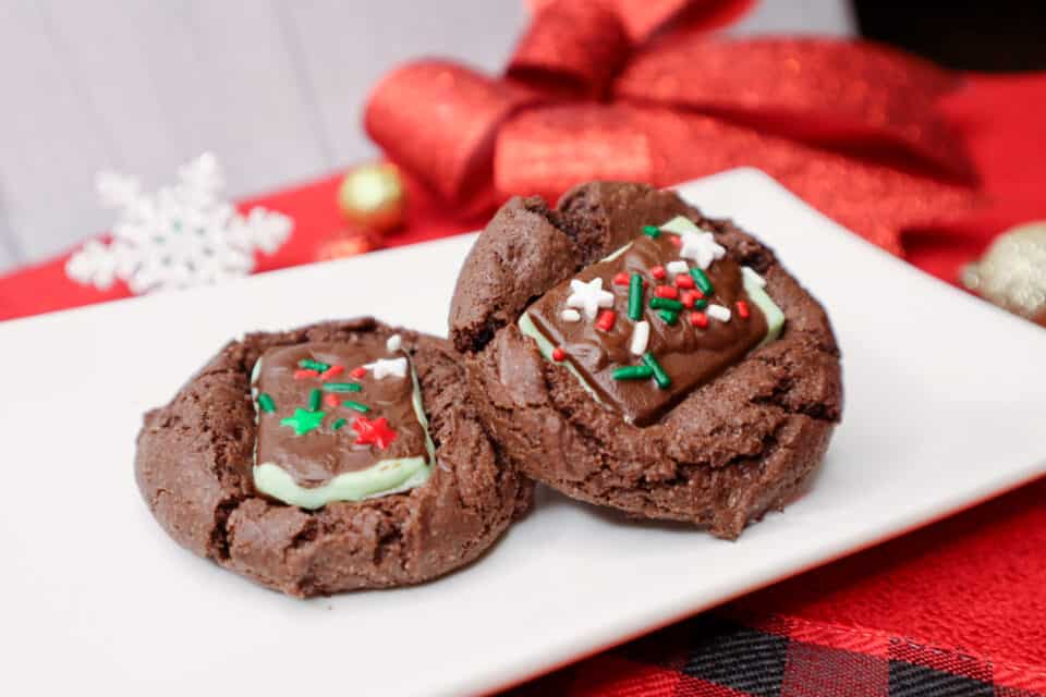 Finished Devil's Food Andes Mint Cookies on a plate with festive decor in the background.