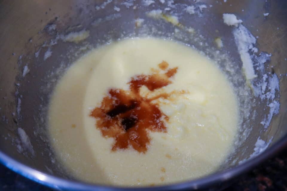 Adding in the vanilla and brown sugar to the mixture in the bowl.
