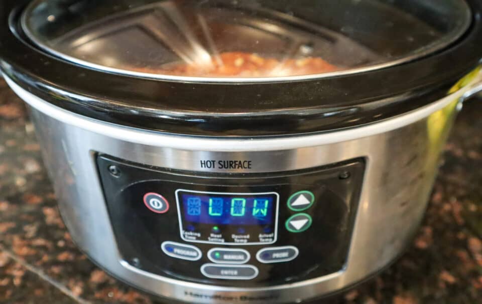 Slow cooker set on low cooking temperature.