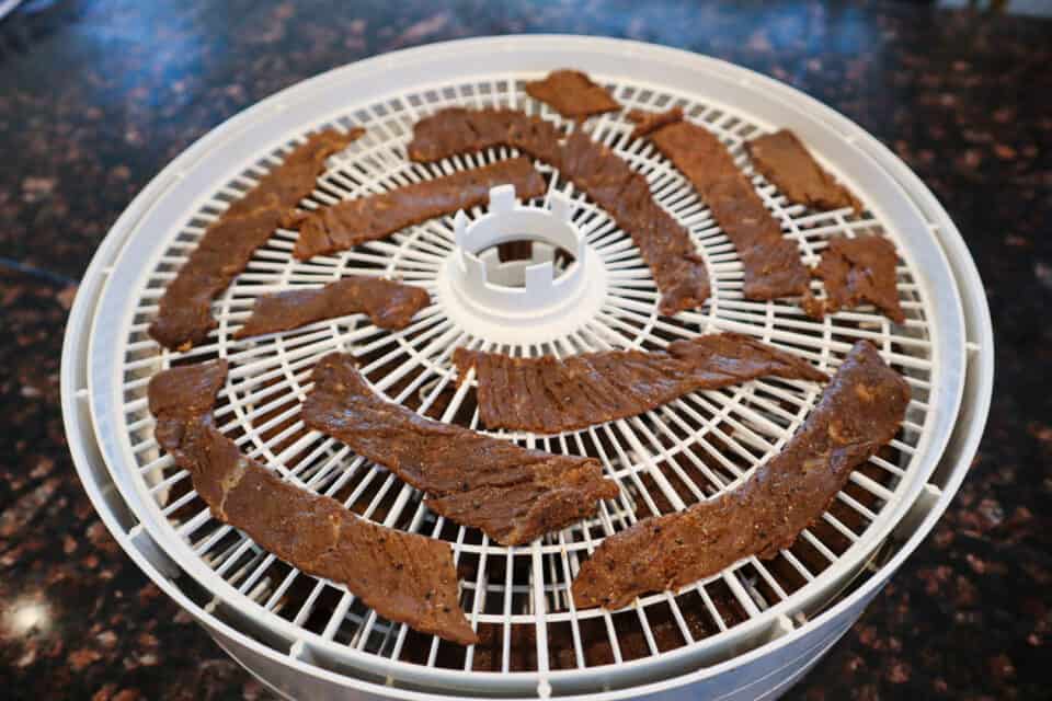 Worcestershire Beef Jerky laid out on a dehydrator tray