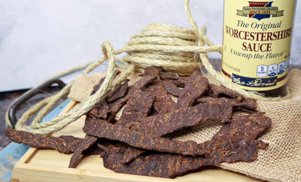 Finished Worcestershire Beef Jerky on a tray with lea & Perrins bottle in the background.