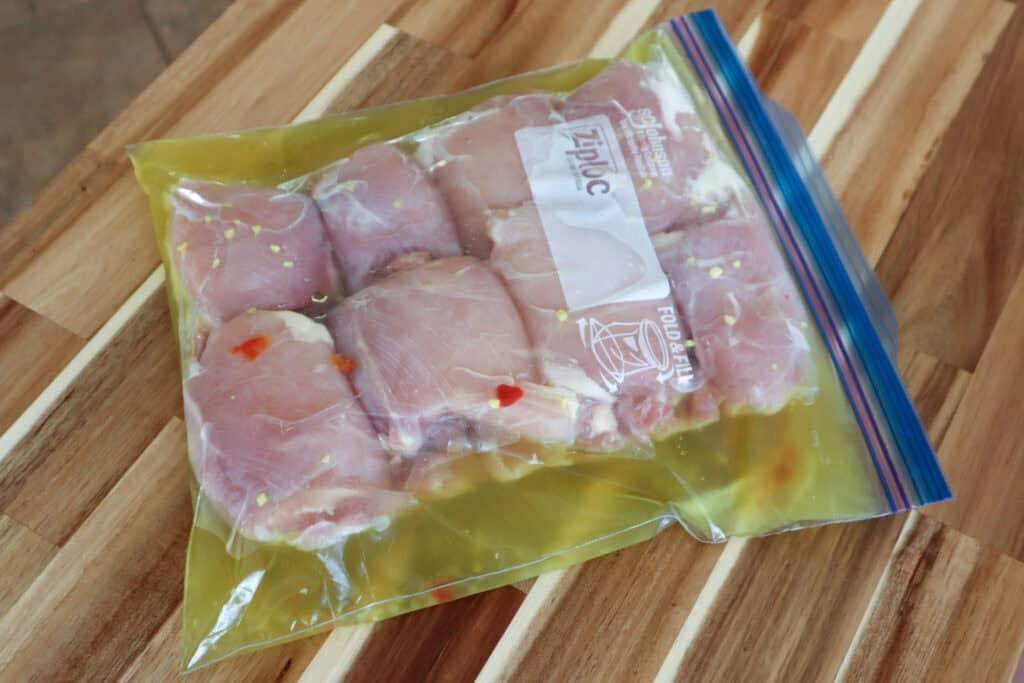 Chicken Thighs brining in the dill pickle juice.