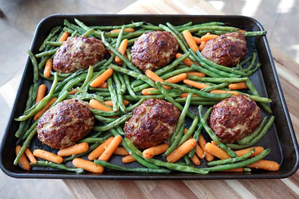 Finished Glazed Mini Turkey Meatloaf Dinner on a sheet pan.