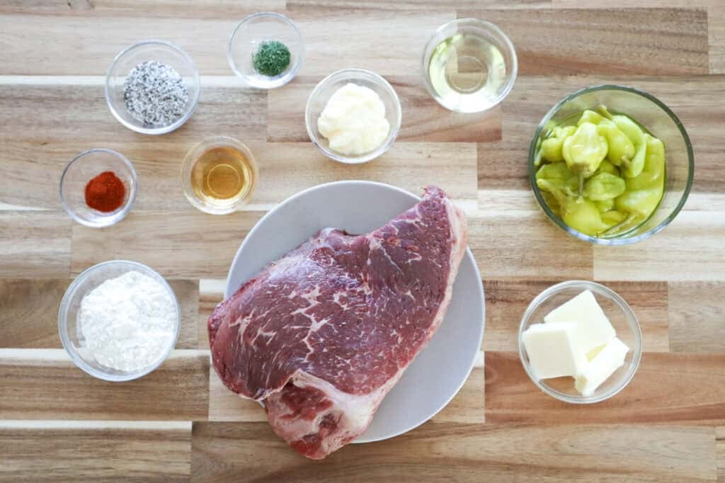 Ingredients for Slow Cooker Mississippi Pot Roast on a board.